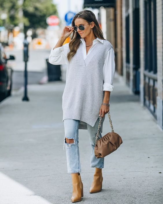 sweter vest style in ripped jeans