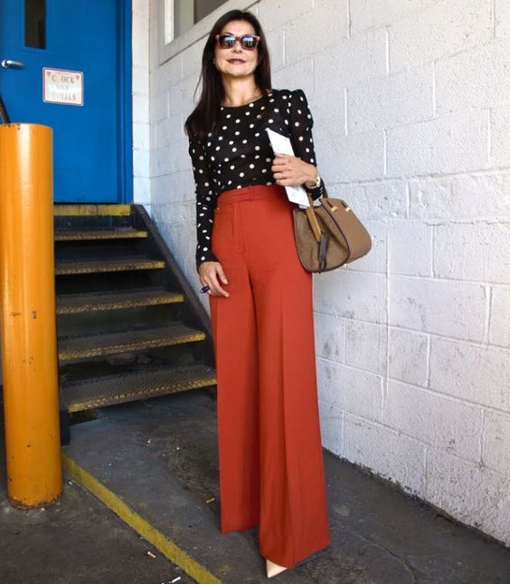 wide-leg pants and a black-white polka dot blouse as elegant work outfits