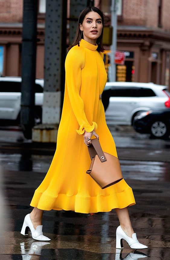 bold yellow maxi dress with brown mini bag for clashing color style