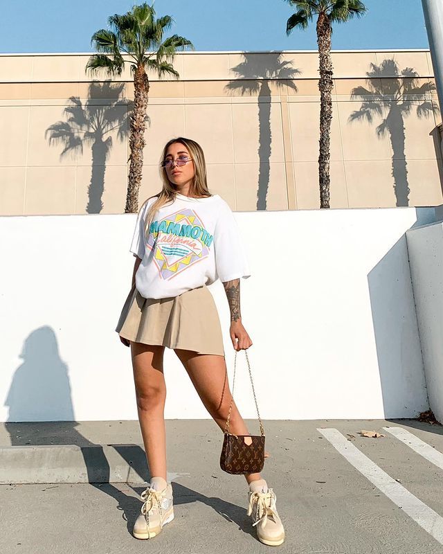 oversized t-shirt and pleated mini skirt