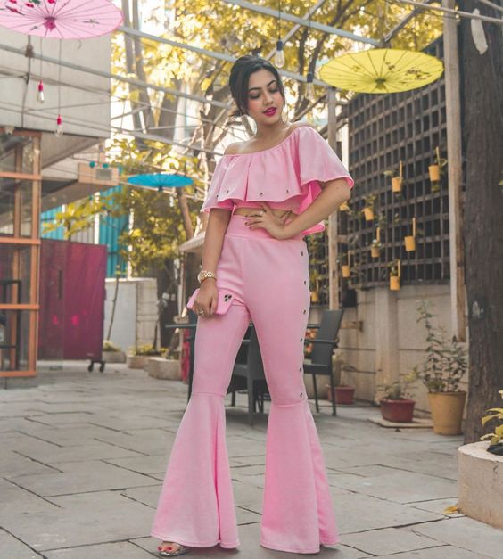pink crop top and flared pants for pretty pastel color outfit