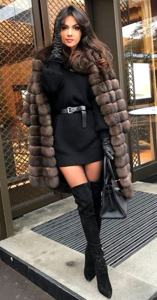 a turtleneck knitted mini dress that's covered by fur women's coats