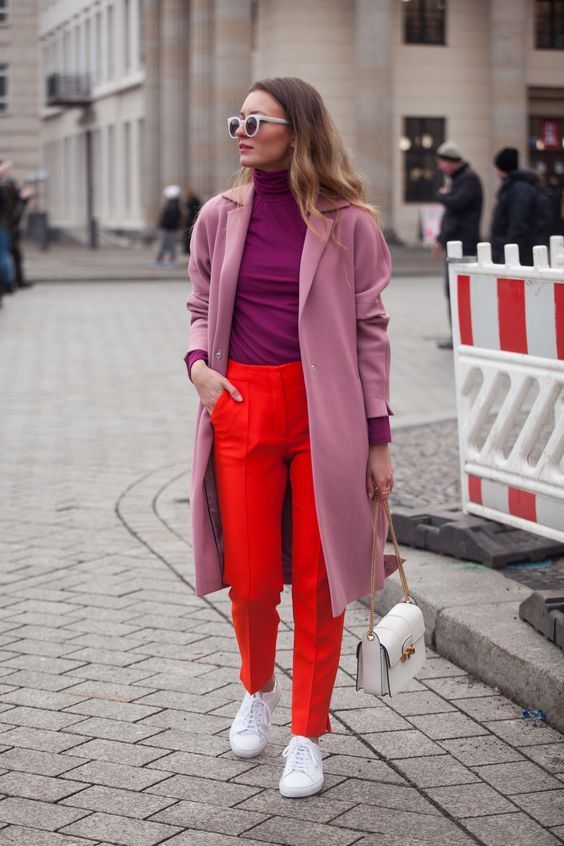 purple turtle neck sweaters and coats with red pants as color clashing outfits