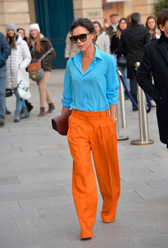wear a blue shirt with orange oversized pants as fashionable color clashing outfits