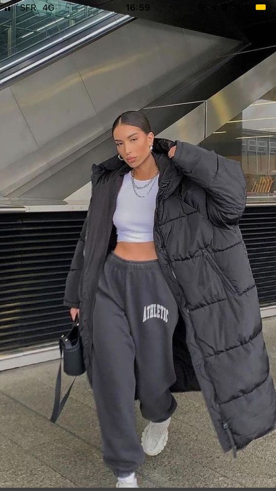 oversized puffer jackets, crop top shirts, and sweatpants for trendy winter outfit