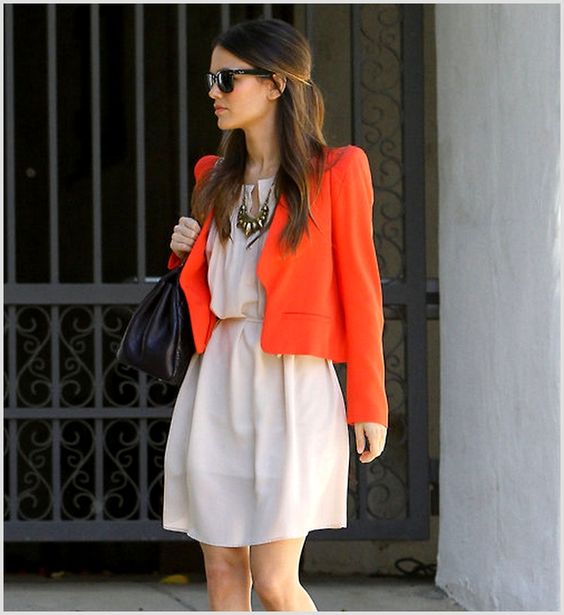 combining orange and cream outfit to form color clashing outfits