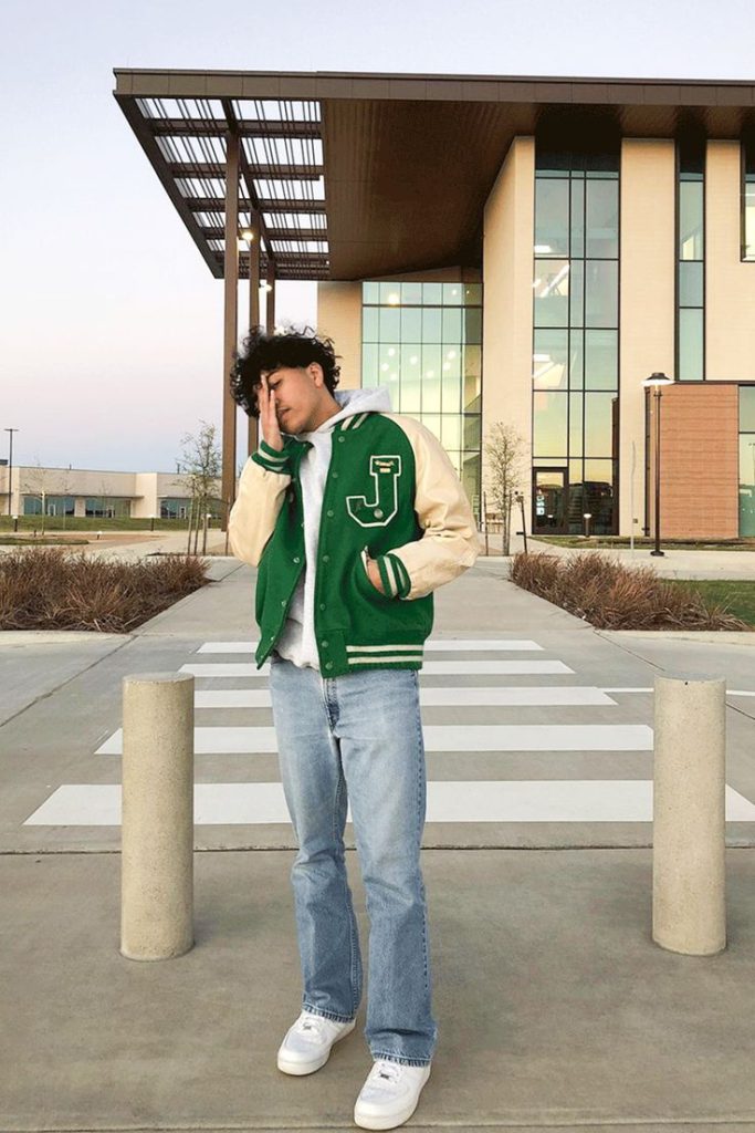 stylish bomber jacket with a hoodie and straight jeans