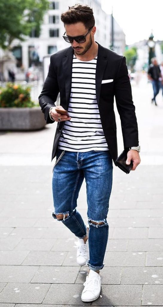 trendy look in a striped t-shirt, blazer, and ripped jeans