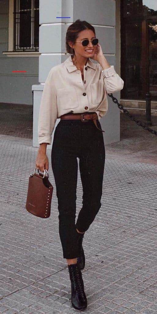 tucking the beige collared shirt to black waist jeans