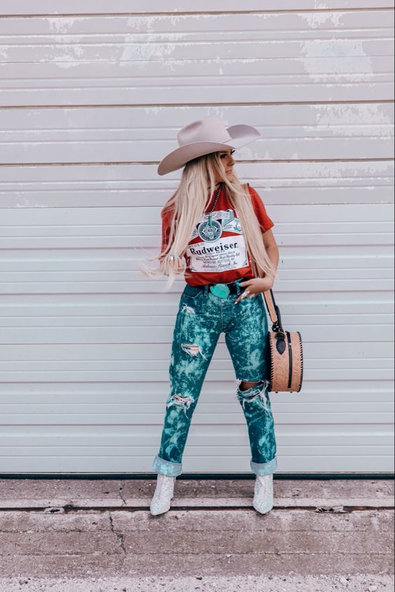 printed red t-shirt and tie-dye ripped jeans