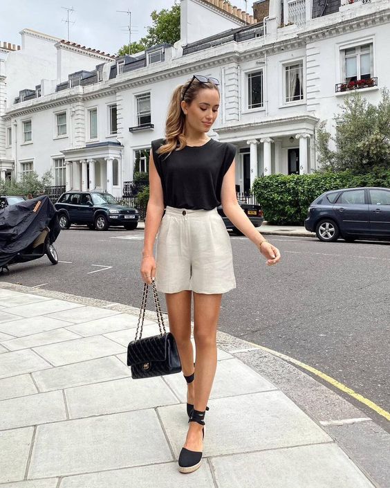 Stand with Sleeveless Tee and Shorts to get elegant summer outfit ideas